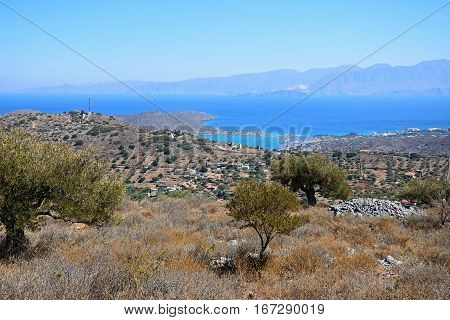 Elevated view of Elounda with views across the sea towards the island of Spinalonga Elounda Crete Greece Europe.