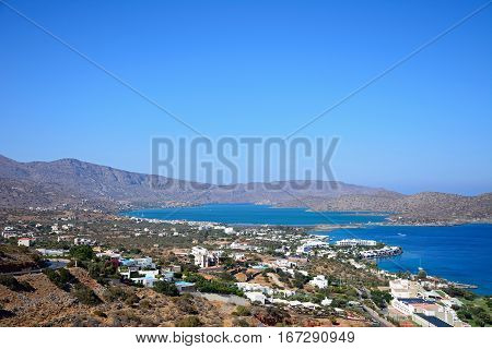 Elevated view of Elounda with views across the sea towards the island of Spinalonga Elounda Crete Greece Europe.