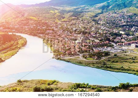 The picturesque landscape with the confluence of the rivers Kura and Aragvi (Mtskheta) in Georgia under the sun
