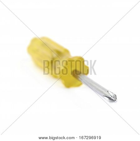 Tiny crosshead screwdriver with a plastic yellow handle, isolated over the white background