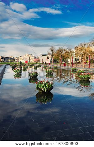 view of museumplein square in Amsterdam with tulips, Netherlands