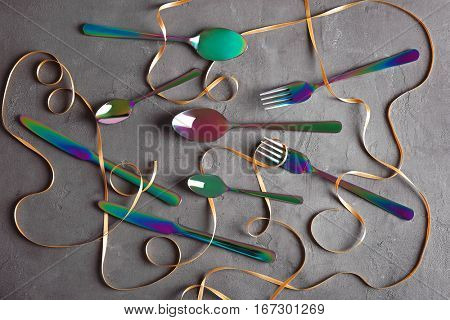 Set of cutlery on grey background