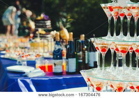 Pyramid glasses. Mount champagne on the table nature, wedding, catering