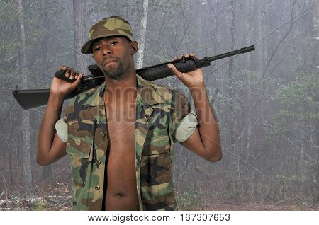 Handsome young black African American man soldier with a rifle