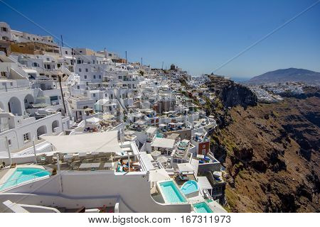 City of Fira hanging on the volcanic caldera at Santorini island in Greece. Santori belongs to the cyclades islands and is a famous summer white houses.