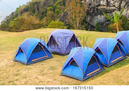 Dome tents on camping site on the mountain beside the cliff at Doi Samer Dao in Nan province Thailand
