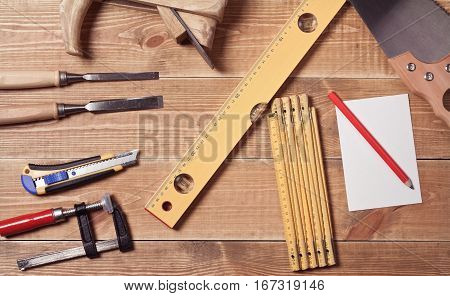 Set of different tools on a wooden planks