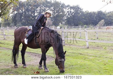 Beautiful young girl with a horse Selective focus and small depth of field lens flare