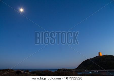 Italy Sardinia Torre di Chia bay night with moon and star