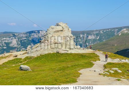 Bucegi Mountains, Romania July 09, 2015: Unidentified Biker Climbs The Hill In Bucegi Mountains In R