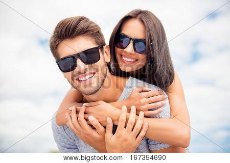 Smiling Happy Man Piggybacking His Girlfriend On Summer Day And Dreaming