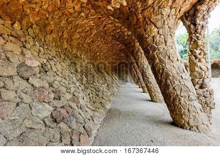 Barcelona, Spain - November 24, 2016: The Laundry Room Portico in Park Guell in Barcelona Spain. It is a public park system composed of gardens and architectonic elements located on Carmel Hill in Barcelona Catalonia (Spain).