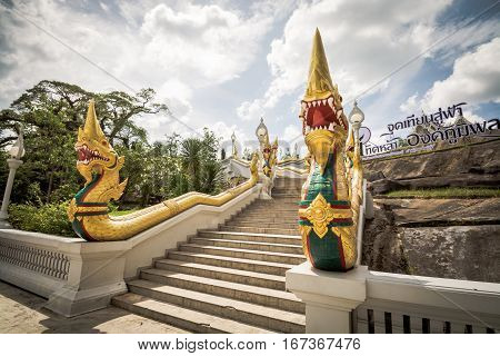 Krabi Thailand - December 26 2016 : Grand staircase lined by naga sculptures in Kaew Korawaram Temple. Krabi Thailand.