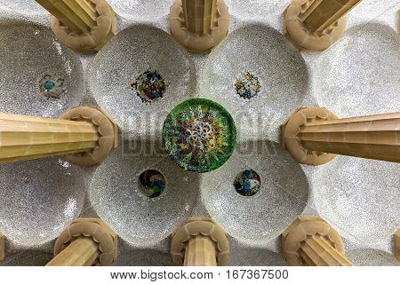 Barcelona, Spain - November 24, 2016: Hypostyle room in Park Guell in Barcelona Spain. It is a public park system composed of gardens and architectonic elements located on Carmel Hill in Barcelona Catalonia (Spain).