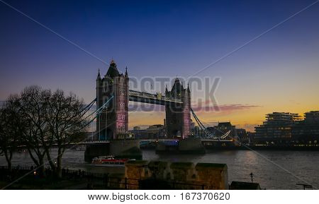 Colorful dramatic sunlgiht at the Tower Bridge and the River Thames London England