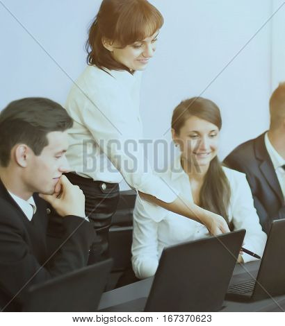 business technology and office concept - smiling business team and discuss profit looking to monitor