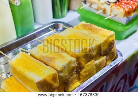 Toast is being prepared for sale in night marketThailand