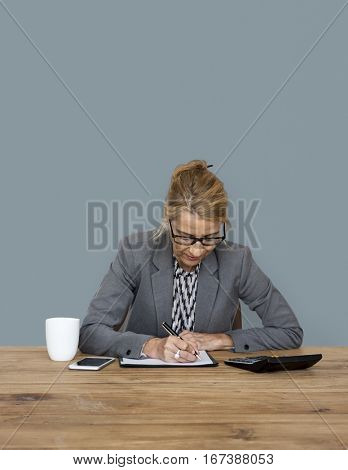 Businesswoman writing down a plan and strategy