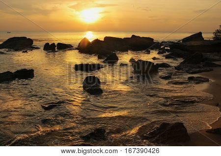 sunset on stony asian beach on vietnamese island phu quock