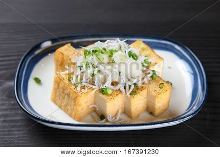 studio shot of tofu cutlets with boiled whitebaite