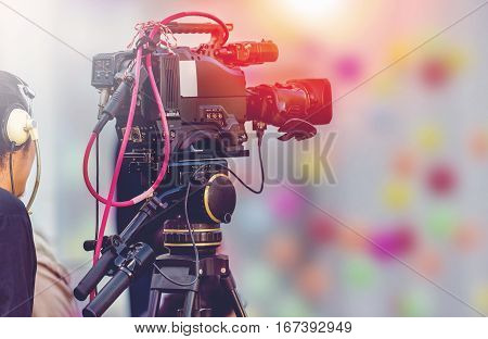 Video camera operator working with his equipment