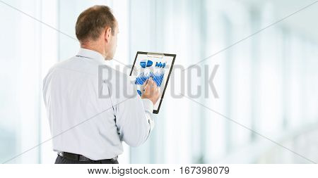 close up and in full growth-investor studies the financial schedule of revenues of the company.photo blurred background and has an empty space for your text