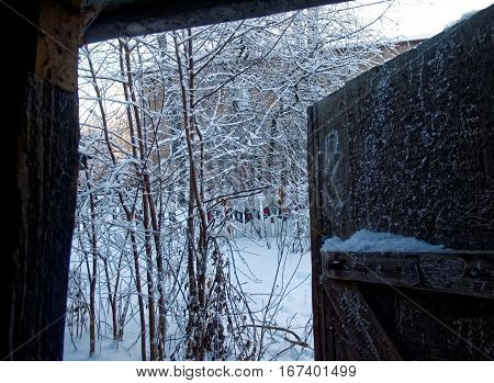 View from the door of the barn on a winter village street