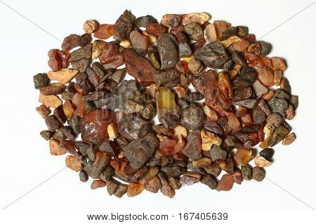 The raw amber from coast of the Baltic sea isolated Background