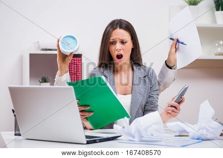 Young businesswoman is angry because she has too much work.