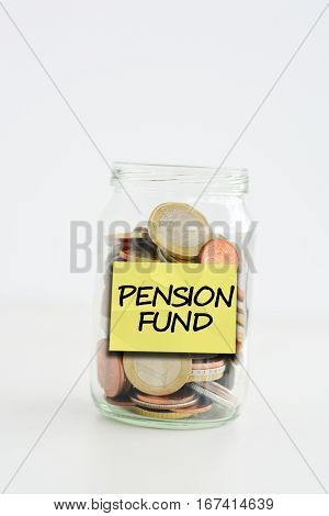 Pension fund label stuck on a glass jar filled with coins