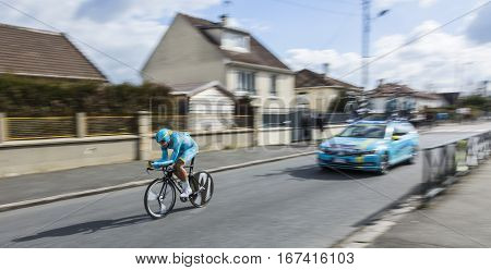 Conflans-Sainte-HonorineFrance-March 62016: The Kazakh cyclist Daniil Fominykh of Astana Team riding during the prologue stage of Paris-Nice 2016.