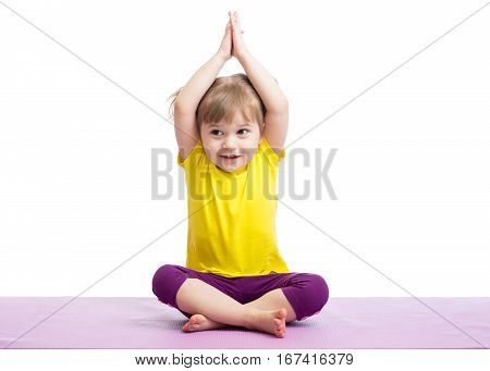 Kid doing fitness exercises over white background