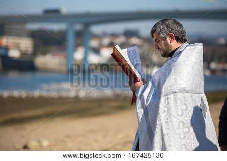 PORTO, PORTUGAL - JAN 19, 2017: Celebrating Baptism of Jesus in the Parish of Russian Orthodox Church near Douro river. This is one of the holiest holidays for all Christians. 