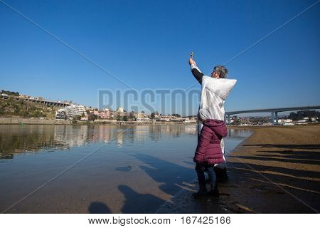 PORTO, PORTUGAL - JAN 19, 2017: Celebrating Baptism of Jesus in the Parish of Russian Orthodox Church near Douro river. This is one of the holiest holidays for all Christians. 
