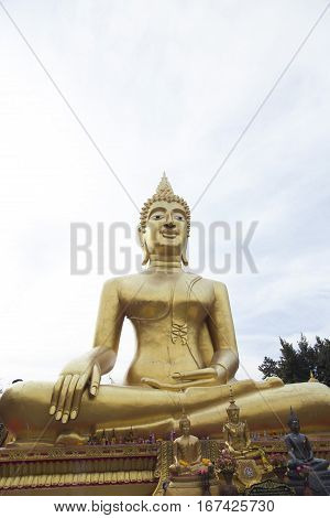 Big Gold Buddha sits and silently watches vanity below