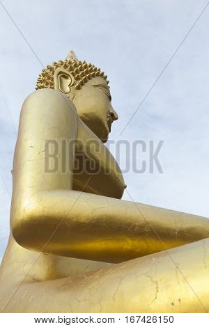 Big Gold Buddha sits and silently watches vanity below