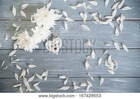 Happy Valentines Day background. Decorative white wooden hearts on grey rustic wooden background. Valentine's Day