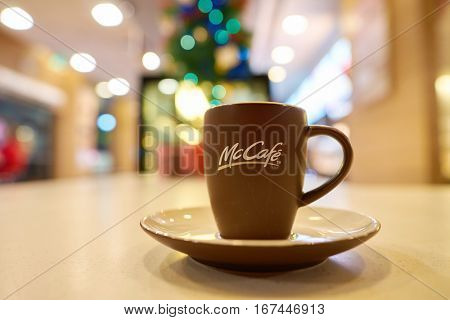 SHENZHEN, CHINA - CIRCA DECEMBER, 2016: close up shot of a cup at McCafe. McCafe is a coffee-house-style food and drink chain, owned by McDonald's.