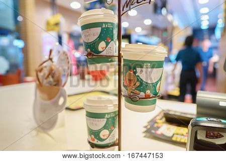 SHENZHEN, CHINA - CIRCA DECEMBER, 2016: cups at a McCafe in Shenzhen. McCafe is a coffee-house-style food and drink chain, owned by McDonald's.