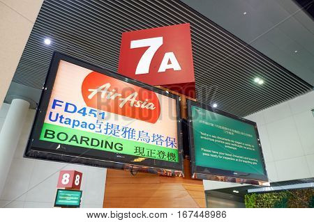 MACAO, CHINA - CIRCA FEBRUARY, 2016: gate monitor for AirAsia flight to Utapao airport at Macau International Airport Terminal.