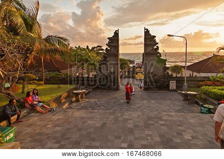 TANAH LOT INDONESIA - January 22 2013. People near entrance to the temple complex of Tanah Lot.