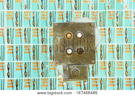 close up of a Old intercom and tiles