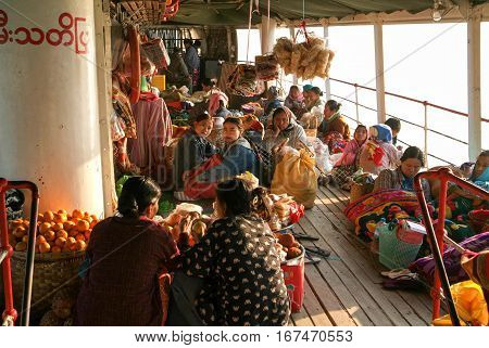River Ayeyarwady Myanmar - 20 January 2010: people on the deck of a passenger ship on the river Ayeyarwady on Myanmar