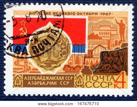 USSR - CIRCA 1967: post stamp printed in the USSR shows Coat of Arms, Flag and monument Azerbaijan SSR, serie 