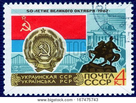 USSR - CIRCA 1967: post stamp printed in the USSR shows Coat of Arms, Flag and monument Ukrainian SSR, serie "50 years of the Great October". circa 1967