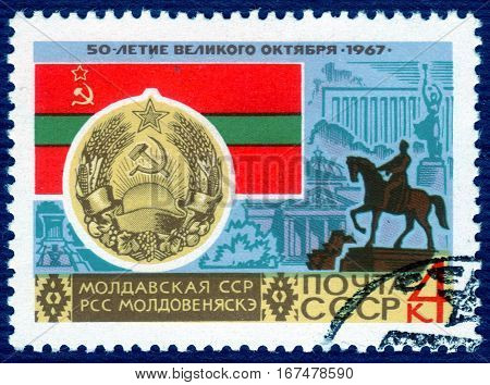 USSR - CIRCA 1967: post stamp printed in the USSR shows Coat of Arms, Flag and monument  Moldovan SSR, serie "50 years of the Great October". circa 1967