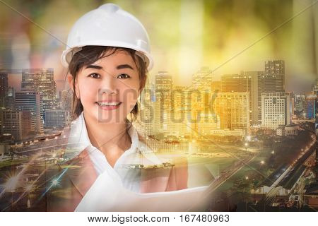 double exposure and soft focused executive Asian engineer woman and cityscape scene business environment engineer concept
