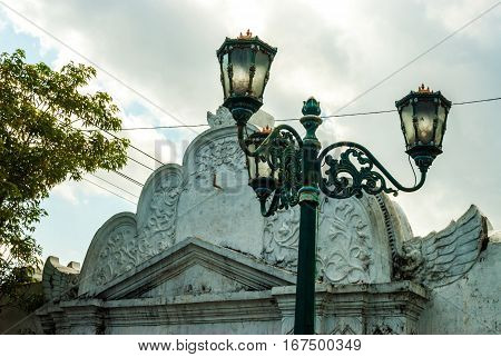 Streetlamp in front of gate to Kraton in morning in Yogyakarta, Indonesia