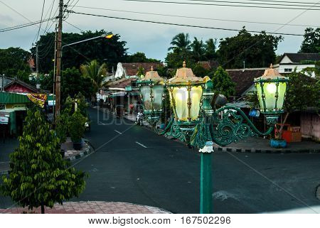 Streetlamp in front of gate to Kraton in the evening in Yogyakarta, Indonesia