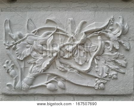 Wall bas-relief stucco in plaster depicts flowers Lily. Bangkok Thailand